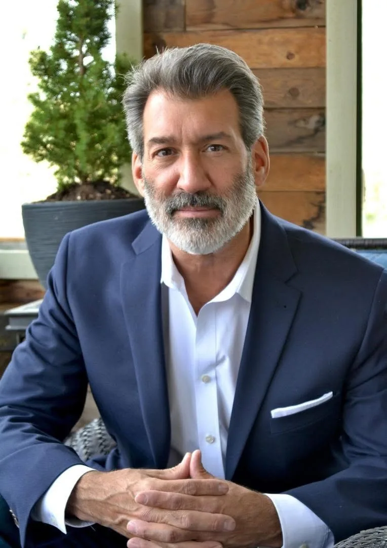 Marco Robert, Founder and CEO of Tillermark, seated and smiling in a navy blazer
